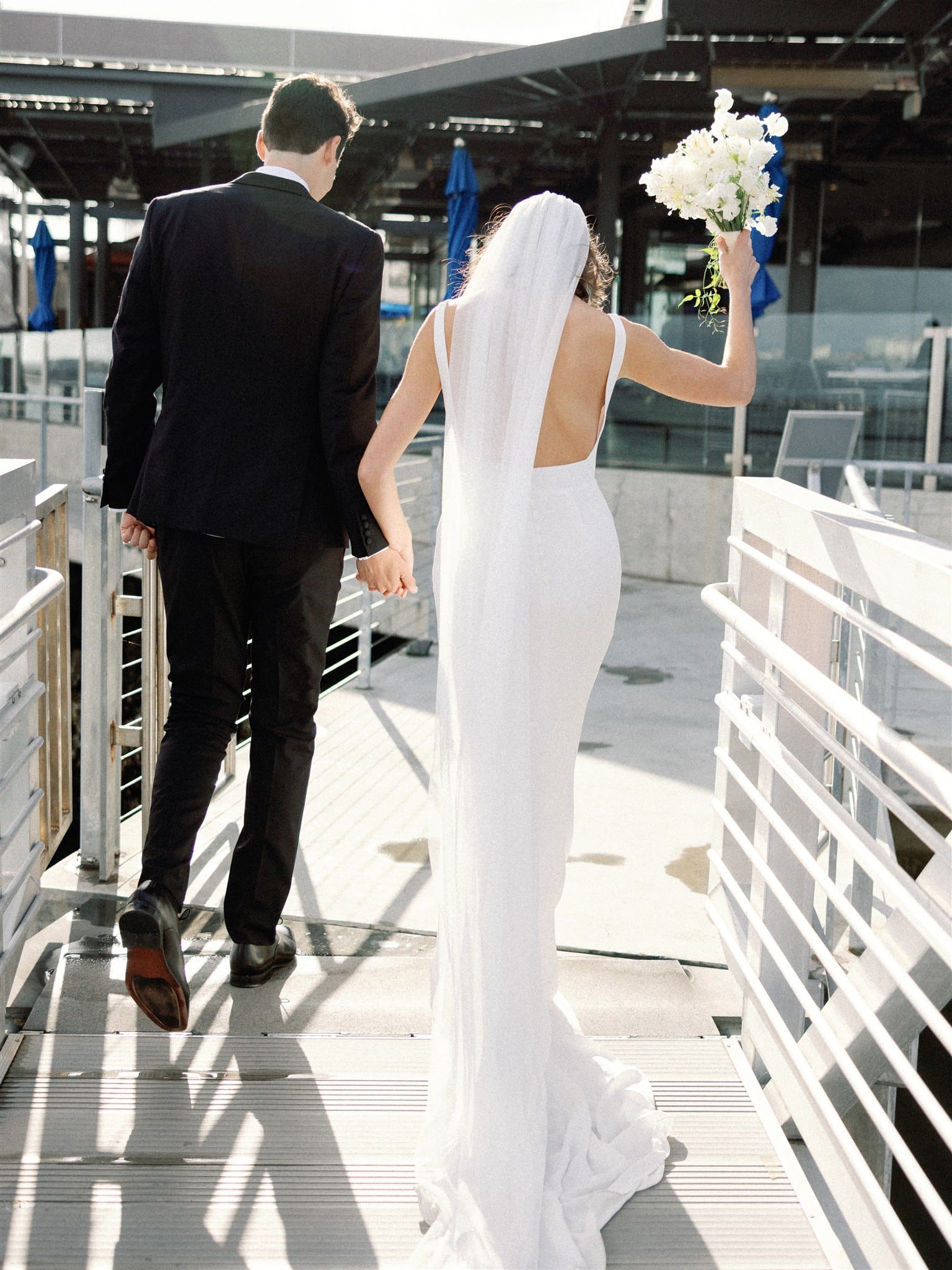 Bride and groom walking out of ceremony hand in hand