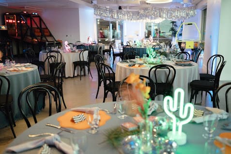 Deck 655 wedding reception tables with neon cactus lights